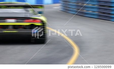 Motion blur race car racing on speed track, Motion blurred super car race on street track circuit, Automobile automotive transportation vehicle background, 128500099
