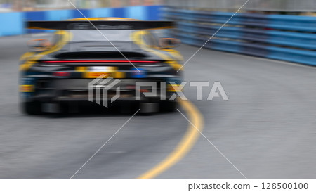 Motion blur race car racing on speed track, Motion blurred super car race on street track circuit, Automobile automotive transportation vehicle background, 128500100