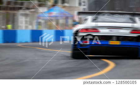 Motion blur race car racing on speed track, Motion blurred super car race on street track circuit, Automobile automotive transportation vehicle background, Motion blur race car racing on speed track, Motion blurred super car race on street track circuit, Automobile automotive transportation vehicle background, 128500105