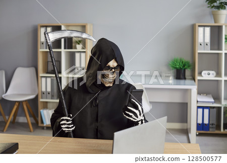 Mobile phone crime, Grim Reaper of Death finding new victim online, Internet scam cybercrime fraud Mobile phone crime, Grim Reaper of Death finding new victim online, Internet scam cybercrime fraud 128500577