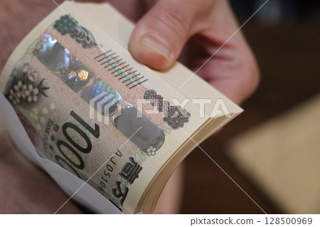Money, stack of bills, million yen 128500969