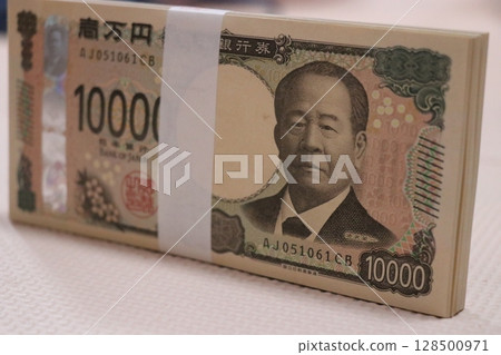 Money, stack of bills, million yen Money, stack of bills, million yen 128500971