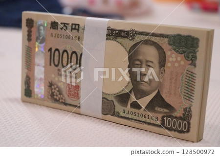 Money, stack of bills, million yen Money, stack of bills, million yen 128500972