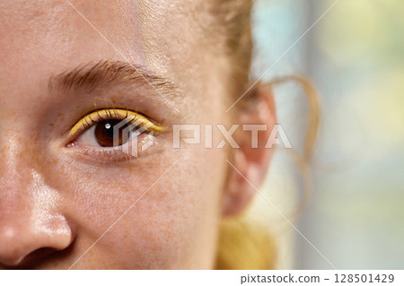 Dopamine makeup. Closeup skincare portrait of smiling woman with colorful eyeliner 128501429