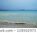 Beautiful Sea View in Olbia, Sardinia. Breathtaking sea view from the coastal city of Olbia in northeastern Sardinia, Italy. The image features crystal-clear turquoise waters, rugged Mediterranean 128502973