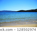 Beautiful Sea View in Olbia, Sardinia. Breathtaking sea view from the coastal city of Olbia in northeastern Sardinia, Italy. The image features crystal-clear turquoise waters, rugged Mediterranean 128502974