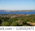 Panoramic View of Palau, Sardinia with La Maddalena Islands. Stunning panoramic view of Palau, a picturesque coastal town in northern Sardinia, Italy, overlooking the shimmering turquoise waters of 128502975