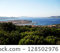 Panoramic View of Palau, Sardinia with La Maddalena Islands. Stunning panoramic view of Palau, a picturesque coastal town in northern Sardinia, Italy, overlooking the shimmering turquoise waters of 128502976