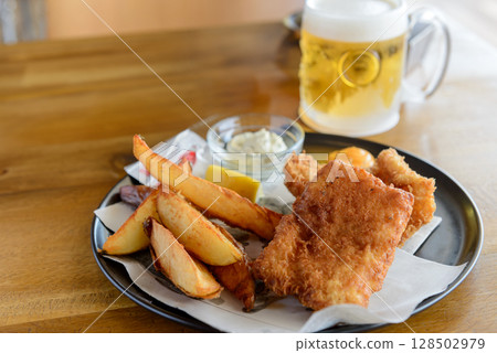 Fish and chips, beer 128502979