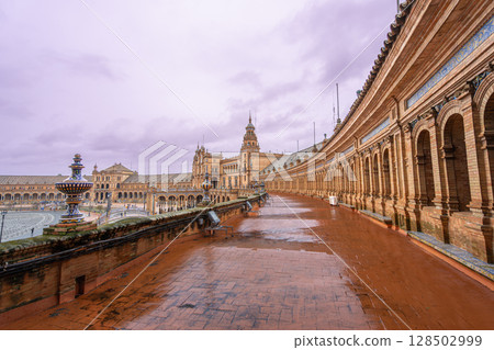Sevilla Plaza de Espana Fountain in Spring Rainy Dusk. Sevilla Plaza de Espana Fountain in Spring Rainy Dusk. 128502999
