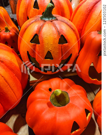 Halloween pumpkins showing scary faces waiting to be purchased 128503102