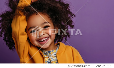 Happy Little Girl with Curly Hair in Yellow Jacket Happy Little Girl with Curly Hair in Yellow Jacket 128503988