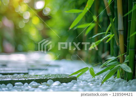 The art of Zen garden, close-up of bamboo within a serene Japanese garden, complemented by rocks and white sand The art of Zen garden, close-up of bamboo within a serene Japanese garden, complemented by rocks and white sand 128504421