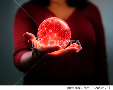 Abstract red sphere floating in the palm of your hand Abstract red sphere floating in the palm of your hand 128504781