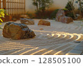 The art of Zen garden, close-up of bamboo within a serene Japanese garden, complemented by rocks and white sand 128505100