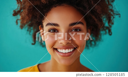 happy young woman with curly hair smiling happy young woman with curly hair smiling 128505185