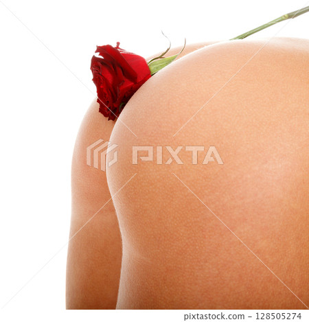 Red rose flower on a female butt, isolated on white background Red rose flower on a female butt, isolated on white background 128505274
