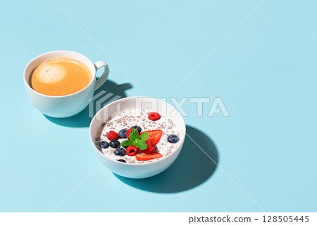 Healthy breakfast with chia bowl and cappuccino coffee Healthy breakfast with chia bowl and cappuccino coffee 128505445