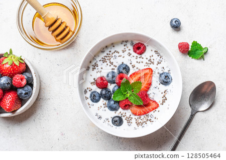 Overnight chia bowl with yogurt, berries and honey Overnight chia bowl with yogurt, berries and honey 128505464