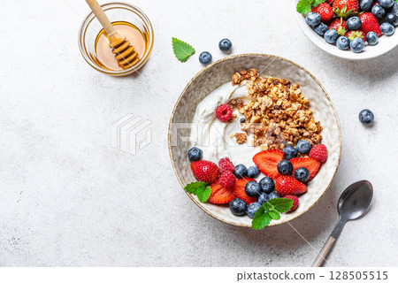 Granola bowl with greek yogurt and fresh berries Granola bowl with greek yogurt and fresh berries 128505515