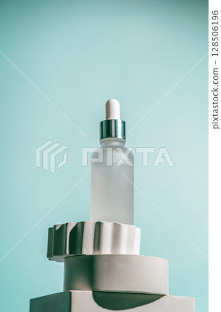 A frosted dropper bottle of facial serum A frosted dropper bottle of facial serum 128506196