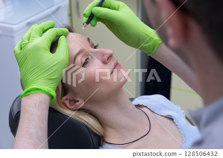 A Close-up View of a Cosmetic Procedure: A Patient Receiving Precise Treatment for Eyebrow Shaping in a Modern Beauty Clinic Environment A Close-up View of a Cosmetic Procedure: A Patient Receiving Precise Treatment for Eyebrow Shaping in a Modern Beauty Clinic Environment 128506432