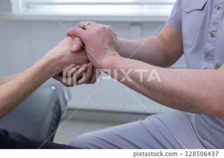Gentle Physical Therapy Session: A Therapist Supporting Recovery Through Hand Support and Connection in a Calm, Healing Environment 128506437