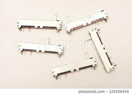 Slider potentiometers. Variable resistors. Devices for voltage changes. 128506458