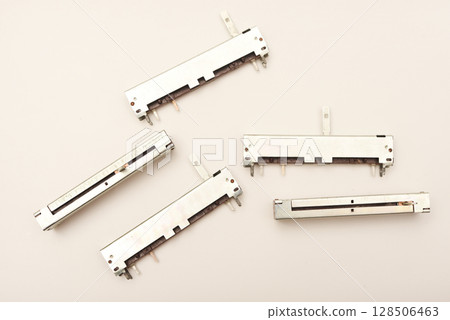 Slider potentiometers. Variable resistors. Devices for voltage changes. 128506463