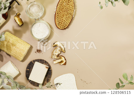 Natural mushroom cosmetics. Mushroom scrub, organic soap, dry mushrooms and natural bath accessories on beige background. Wellness, skin care and spa relax treatment concept. Flat lay, copy space 128506515