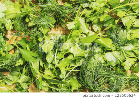 Fresh green parsley and dill on wooden board. Greenery vegan background with healthy vegetables. Season, farm product. Flat lay 128506624