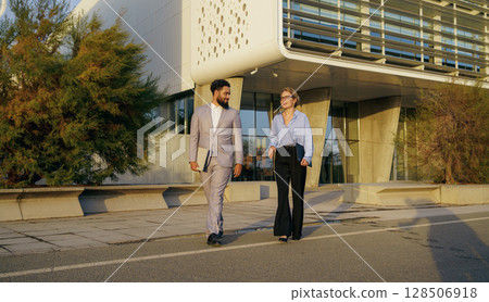 A Professional Business Meeting Taking Place Outdoors in a Modern City Environment for Networking A Professional Business Meeting Taking Place Outdoors in a Modern City Environment for Networking 128506918