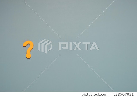 Yellow Question Mark on Blue Background with Copy Space Yellow Question Mark on Blue Background with Copy Space 128507031