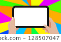 Digital Tablet in Hands with Colorful Radial Background 128507047