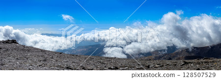 Cloudy over mountains on hiking trail to Mulhacen peak, Sierra Nevada National park, Andalusia, Spain 128507529