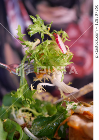 Enjoy the Fresh Salad Delight with assorted Greens and Radishes 128507850