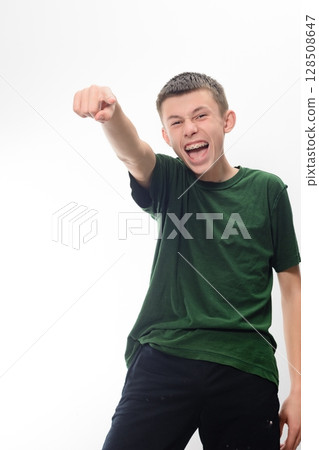 Excited Teenager Points and Smiles 128508647