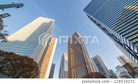Looking up at the buildings of Shinjuku New City in the evening, Tokyo Looking up at the buildings of Shinjuku New City in the evening, Tokyo 128510271