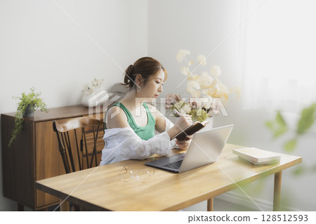 A woman using a computer A woman using a computer 128512593