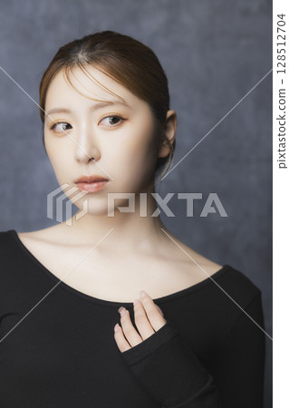Beauty portrait on a black background Beauty portrait on a black background 128512704