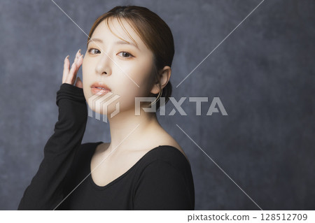 Beauty portrait on a black background Beauty portrait on a black background 128512709