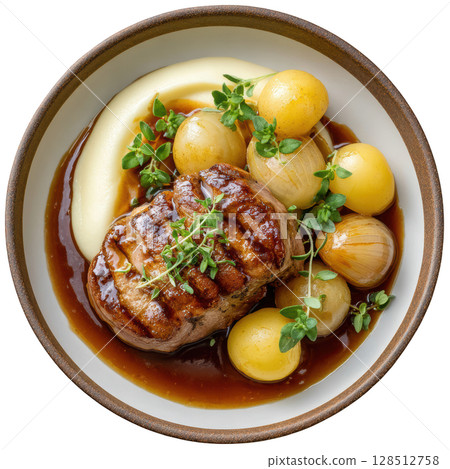Braised pork shoulder tender with cider glaze served with smoked potato puree, glazed baby apples, and fresh micro sage garnish 128512758