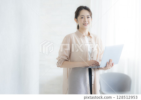 Woman working in the office 128512953