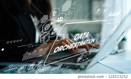 Business Professional Engaged in Data Orchestration with Laptop in a Modern Office Environment. Asymptotic smart data analytic Business Professional Engaged in Data Orchestration with Laptop in a Modern Office Environment. Asymptotic smart data analytic 128513252