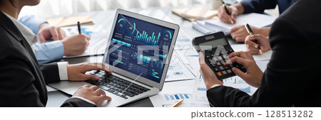 Analyst team working on data analysis dashboard on laptop screen. Insight 128513282