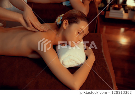Caucasian couple customer enjoying relaxing anti-stress massage. Quiescent Caucasian couple customer enjoying relaxing anti-stress massage. Quiescent 128513392