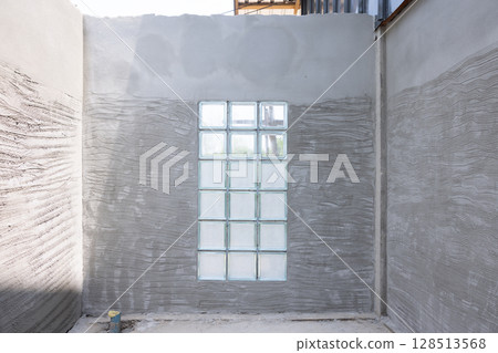 Concrete plastering wall and scrate surface to prepare for tile installation. Concrete plastering wall and scrate surface to prepare for tile installation. 128513568