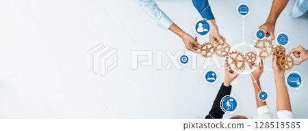 Collaboration and teamwork concept with gears and icons representing various business functions and roles in a modern workspace.. Amity Collaboration and teamwork concept with gears and icons representing various business functions and roles in a modern workspace.. Amity 128513585