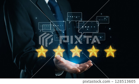 Businessman Presenting Five Golden Stars with Feedback Bubbles for Customer Reviews and Ratings in a Professional Setting on a Dark Background. Qubit 128513605