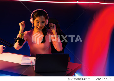 Smiling Asian influencer talking podcast with positive in red frame. Stratagem. Smiling Asian influencer talking podcast with positive in red frame. Stratagem. 128513692